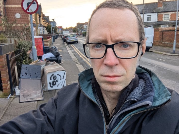 Cllr Rob White by rubbish dumped on Liverpool Road